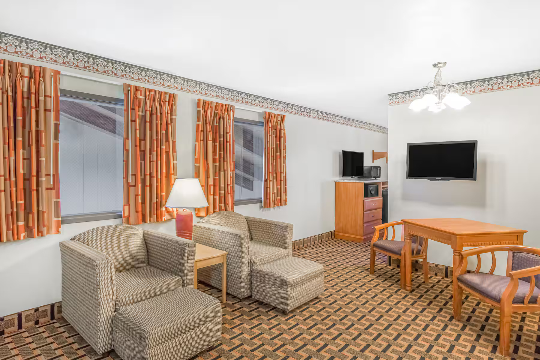 Two women looking at mountains with mist and cliffs